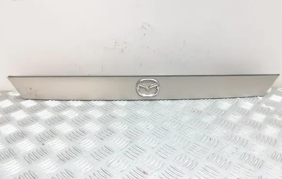 Mazda 626 Trunk door license plate light bar GE4T50811