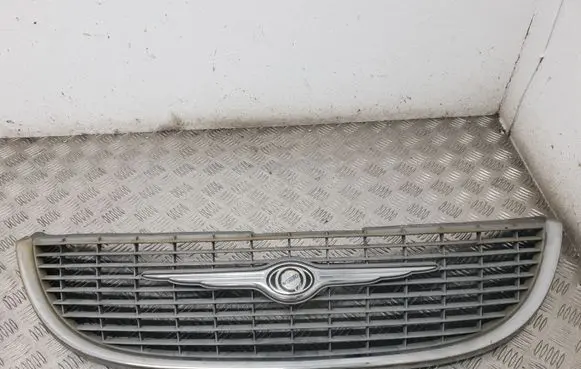 Chrysler Voyager Front bumper upper radiator grill 4857522AA