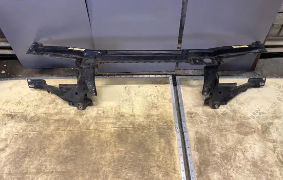 Top upper radiator support slam panel