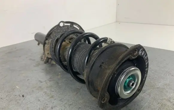 Volkswagen Golf VII Front shock absorber with coil spring 5Q0413023FK