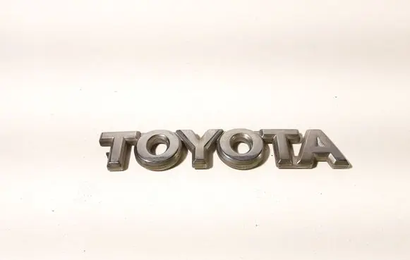 Toyota Corolla E120 E130 Manufacturers badge/model letters 