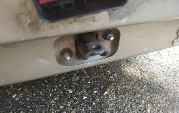 Front door check strap stopper
