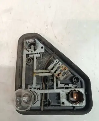 Tail light bulb cover holder