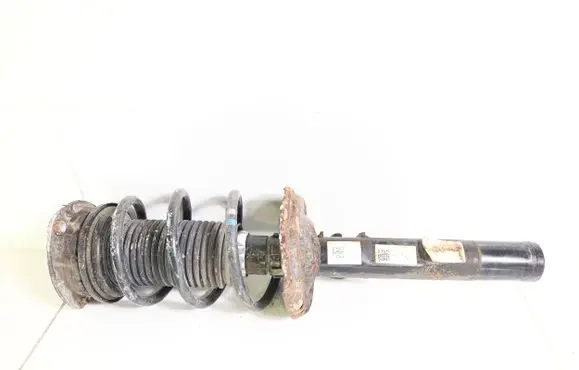 Volkswagen Golf VII Front shock absorber with coil spring 5Q0412013BR 5Q0413023FK