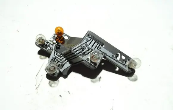 Tail light bulb cover holder