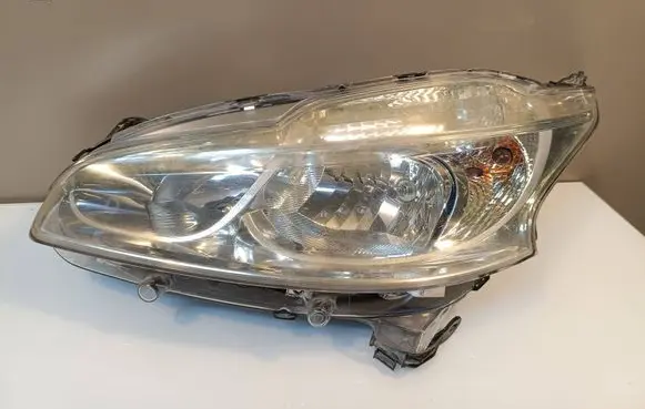 Peugeot 208 I Headlight/headlamp 9802221880