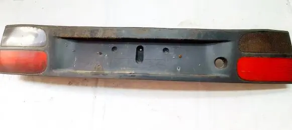 Renault Laguna I Trunk door license plate light bar 7700820049