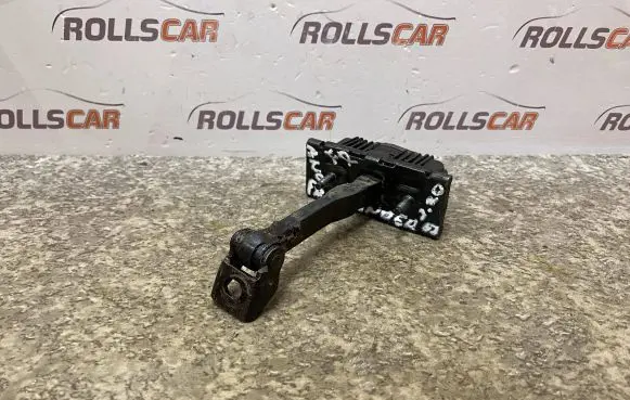 Front door check strap stopper