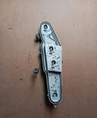 Tail light bulb cover holder