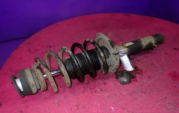 Volkswagen Golf IV Front shock absorber with coil spring 1J0413031S