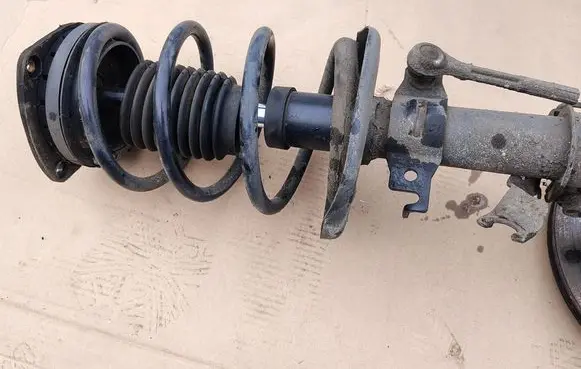 Front shock absorber with coil spring