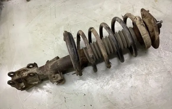 Front shock absorber with coil spring