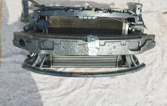 Top upper radiator support slam panel