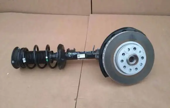 Volkswagen Golf VII Front shock absorber with coil spring 5Q0413023FK