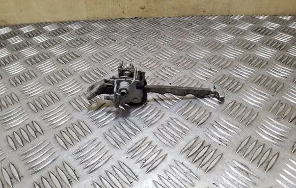 Front door check strap stopper
