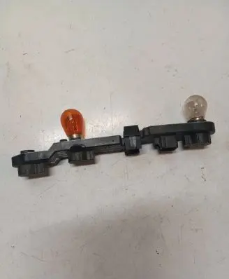 Tail light bulb cover holder