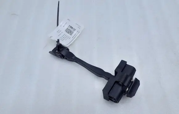 Front door check strap stopper
