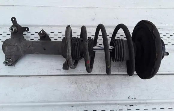 Nissan Primera Front shock absorber with coil spring