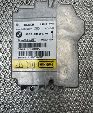 BMW 1 E81 E87 Airbag control unit/module 9166057 0285010066 31916605701J