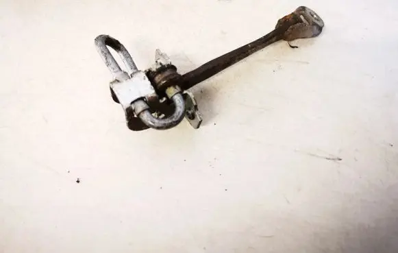 Front door check strap stopper
