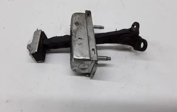 Front door check strap stopper
