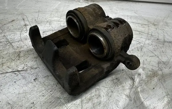 Subaru Forester SF Front brake caliper