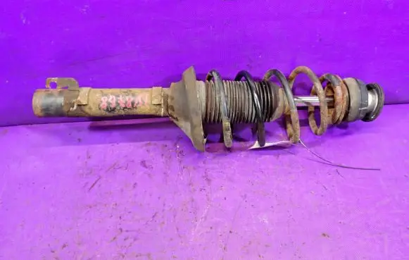 Volkswagen Golf IV Front shock absorber with coil spring 1J0413031S
