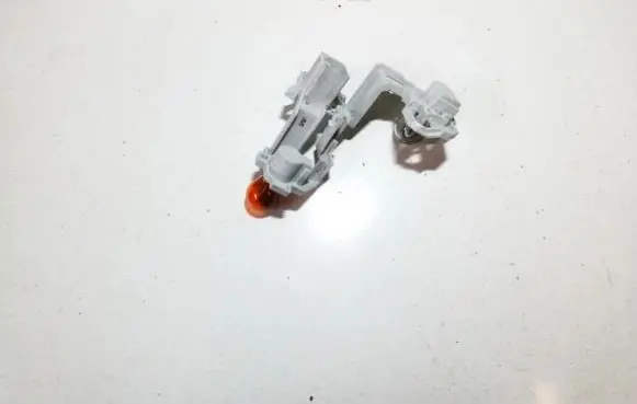 Tail light bulb cover holder