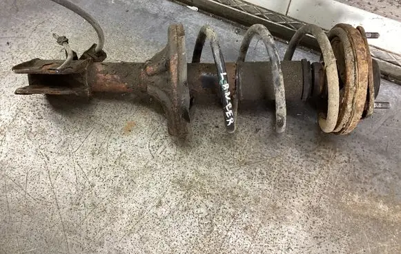 Mitsubishi Lancer Front shock absorber with coil spring