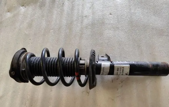 Volkswagen Caddy Front shock absorber with coil spring 311863