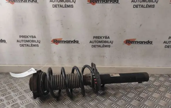 Volkswagen Caddy Front shock absorber with coil spring 1K0413031BA
