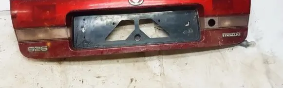 Mazda 626 Trunk door license plate light bar 0431394 043-1394