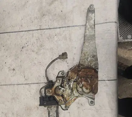 Rear door window regulator with motor