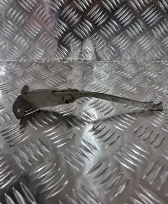 Front door check strap stopper