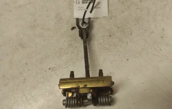Front door check strap stopper