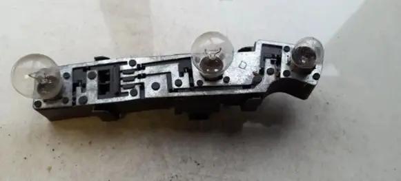 Tail light bulb cover holder