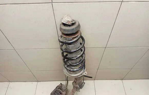 Volkswagen Golf III Front shock absorber with coil spring 1H0413031L
