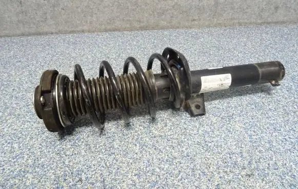 Volkswagen Jetta VI Front shock absorber with coil spring 5C0413031BB