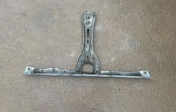 Top upper radiator support slam panel