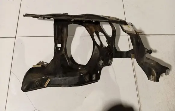 Radiator support slam panel