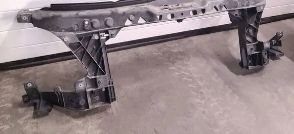 Radiator support slam panel