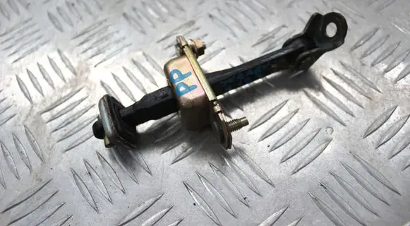 Front door check strap stopper