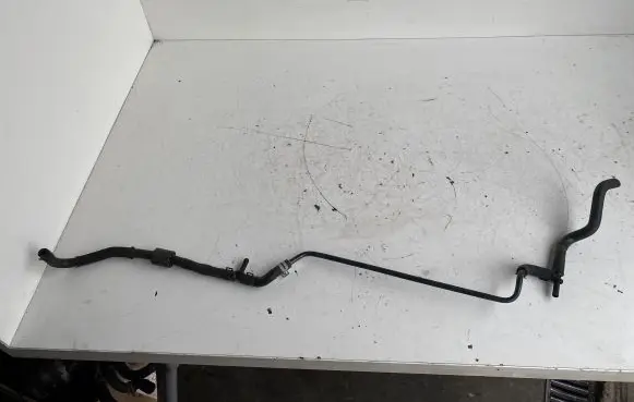 Volkswagen Golf VII Engine coolant pipe/hose 04E121064E