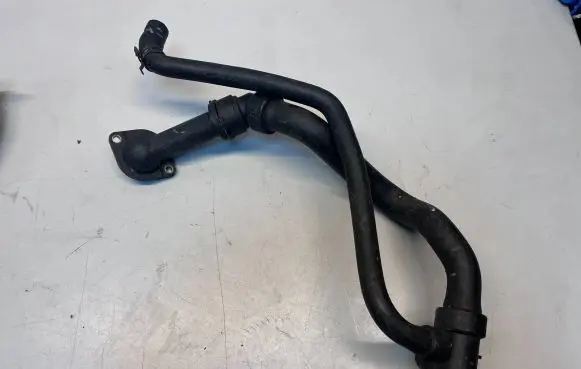 Volkswagen PASSAT B5 Engine coolant pipe/hose 06B121121 4B0121049S