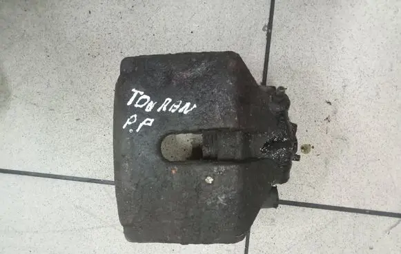 Volkswagen Touran I Front brake caliper 0000