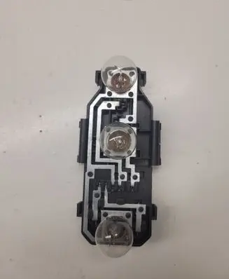 Tail light bulb cover holder