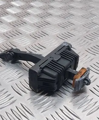 Front door check strap stopper