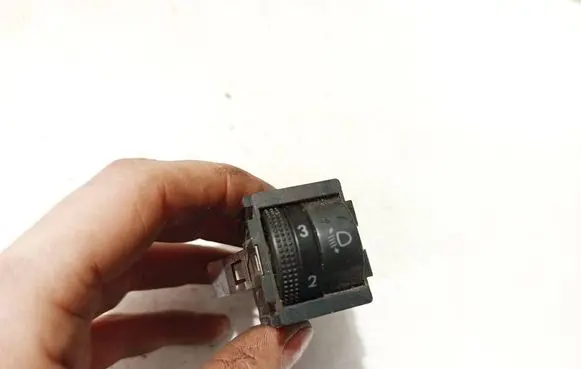 Headlight level height control switch