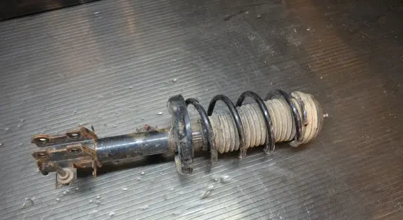Opel Corsa D Front shock absorber with coil spring