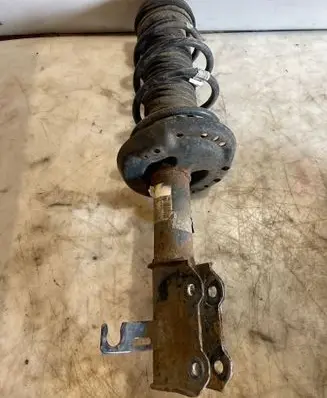 Front shock absorber with coil spring